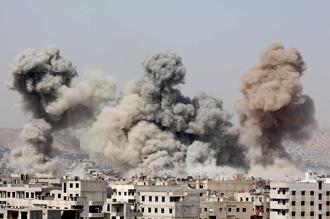 FILE PHOTO Smoke rises after what activists said were air strikes by forces loyal to Syrias President Bashar alAssad in Arbeen in the eastern Damascus suburb of Ghouta جلنار Jollanar
